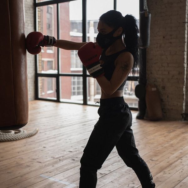 Close-up of an athletic man's focused face during exercise.