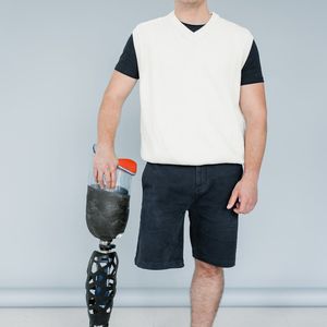 Man holding a difficult balance pose on one leg.